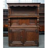 A 17th century oak court cupboard/Tridarn, the open upper tier over two pairs of panelled...