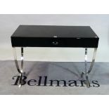 'RU ASHLEY', a modern chrome and black glass single drawer side table