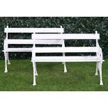 A pair of early 20th century white painted cast iron garden benches (2).