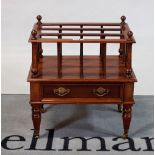 A Victorian mahogany three-division Canterbury with single drawer on turned supports,