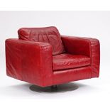 Natuzzi, a red leather upholstered square back easy armchair on chrome swivel base, 90cm wide...