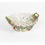 A Meissen outside- decorated two-handled circular pierced basket, late 19th century, applied...