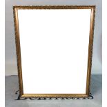 A large modern gilt rectangular mirror