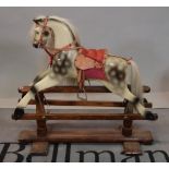 A modern child's rocking horse and two early 20th century dolls prams (3)