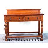 A 20th century two drawer oak side table