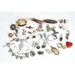 A group of silver mounted and other jewellery, comprising; an oval butterfly wing brooch,...