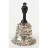 A French table bell. decorated with a palmette band, fitted with an ebonised handle, height 8...