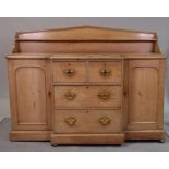 A Victorian pine breakfront sideboard