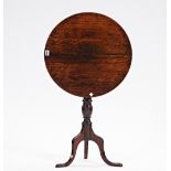 An 18th century oak circular snap top tripod occasional table, 52cm diameter x 64cm high.