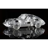 A Daum crystal model of a Porsche 911 Carrera, first produced in 1987, designed by Xavier...