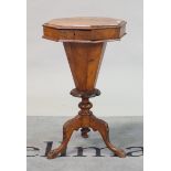 A Victorian walnut trumpet shape work table on tripod base