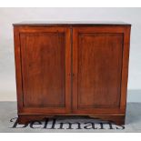 A late George III mahogany side cupboard on bracket feet