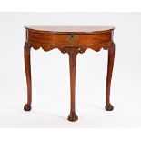 A George II style demi-lune side table with lift top on three claw and ball supports, 77cm...
