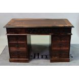 A carved oak kneehole desk, early 20th century, in period style