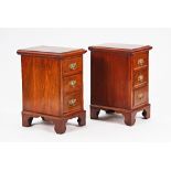 A pair of George III style mahogany three drawer pedestals (2).