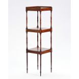 A 19th century mahogany three tier what-not on turned supports, 40cm wide x 139cm high.