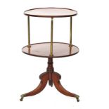 A George III mahogany and brass circular two tier dumb waiter