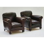 A pair of French style studded leather upholstered easy armchairs