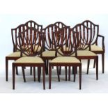 A set of eight Hepplewhite style mahogany shield back dining chairs