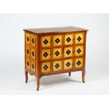 A Transitional style walnut three drawer commode