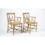 A pair of cream-painted rush seat armchairs