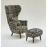 An exaggerated wingback easy armchair