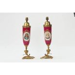 A pair of French gilt-metal and porcelain table lamps