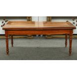 A French fruitwood draw leaf extending dining table
