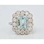 A platinum, aquamarine and diamond cluster ring