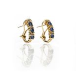 A pair of gold, sapphire and diamond earclips