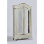 A cream and green painted armoire