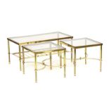 A set of three lacquered brass and glass occasional tables