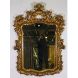 An 18th century style gilt framed shaped rectangular wall mirror