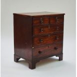 A narrow mahogany chest