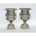 A pair of large silver painted baluster urns