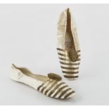 Queen Victoria's cream satin and gold thread ballet style slippers, circa 1840s/1850s
