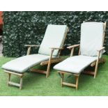 A pair of modern slatted teak Steamer chairs