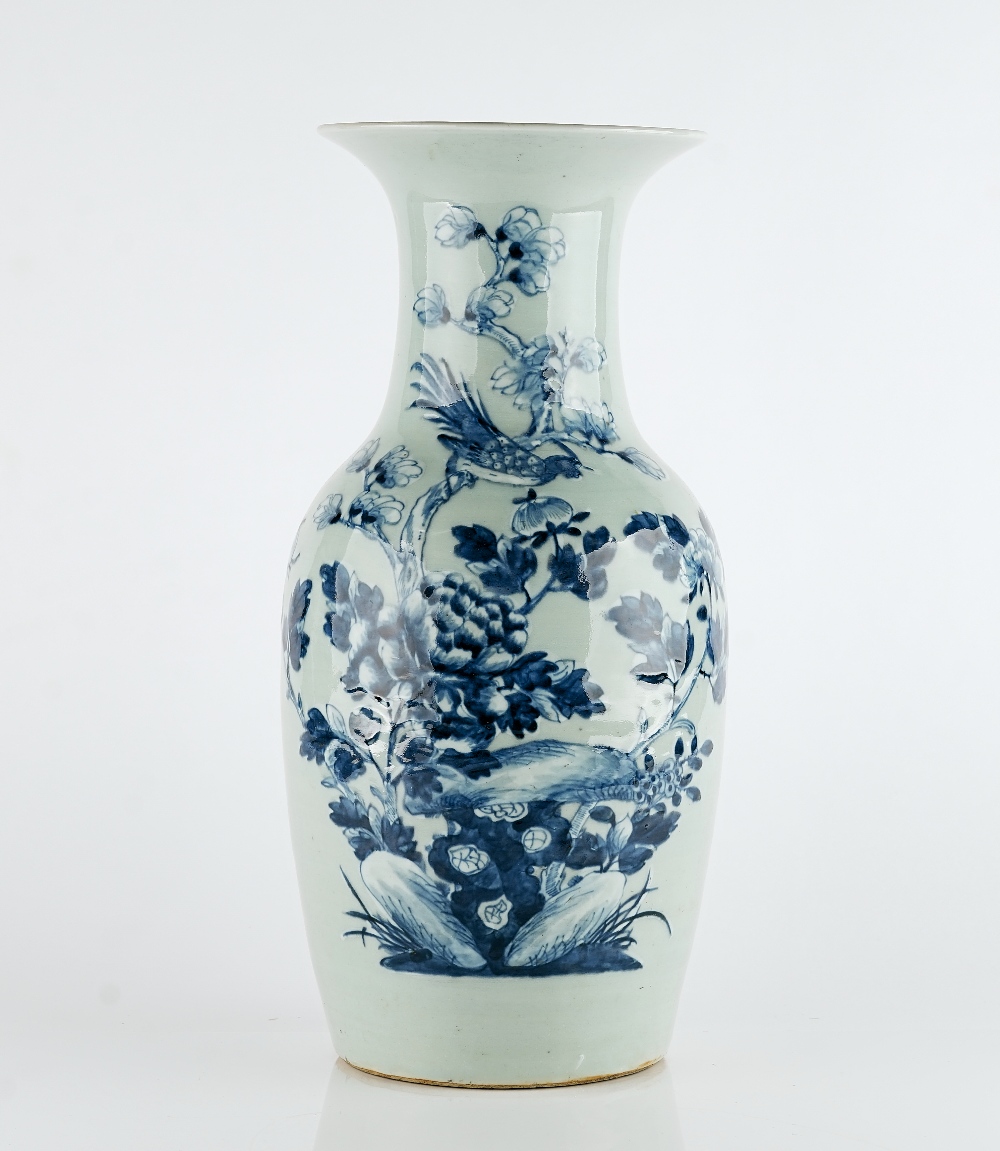 A Chinese blue and white celadon- ground baluster vase