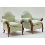 A pair carved walnut framed humpback easy armchairs