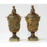 A pair of ormolu urns and covers