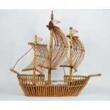 A bamboo and cane hanging light modelled as three-mast ship