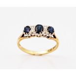 An 18ct gold, sapphire and diamond ring