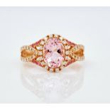 An 18ct rose gold morganite and diamond cluster ring