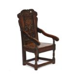 A Charles II oak Wainscot open armchair