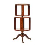 An Edwardian floral polychrome painted twin section revolving bookstand