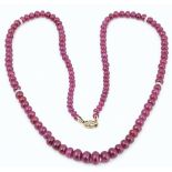 A single row necklace of graduated ruby beads