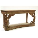 A stripped beech console table base