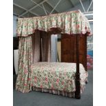 A George III style mahogany four poster double bed