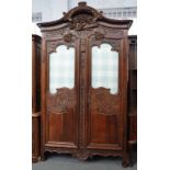 A French carved oak armoire