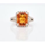 A platinum, citrine and diamond set ring